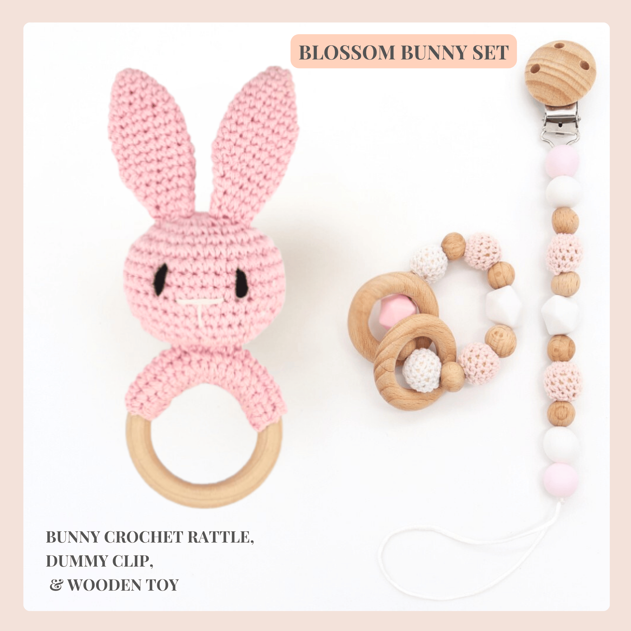 Blossom Bunny Set with pink crochet rattle, wooden dummy clip, and wooden toy on a light background.