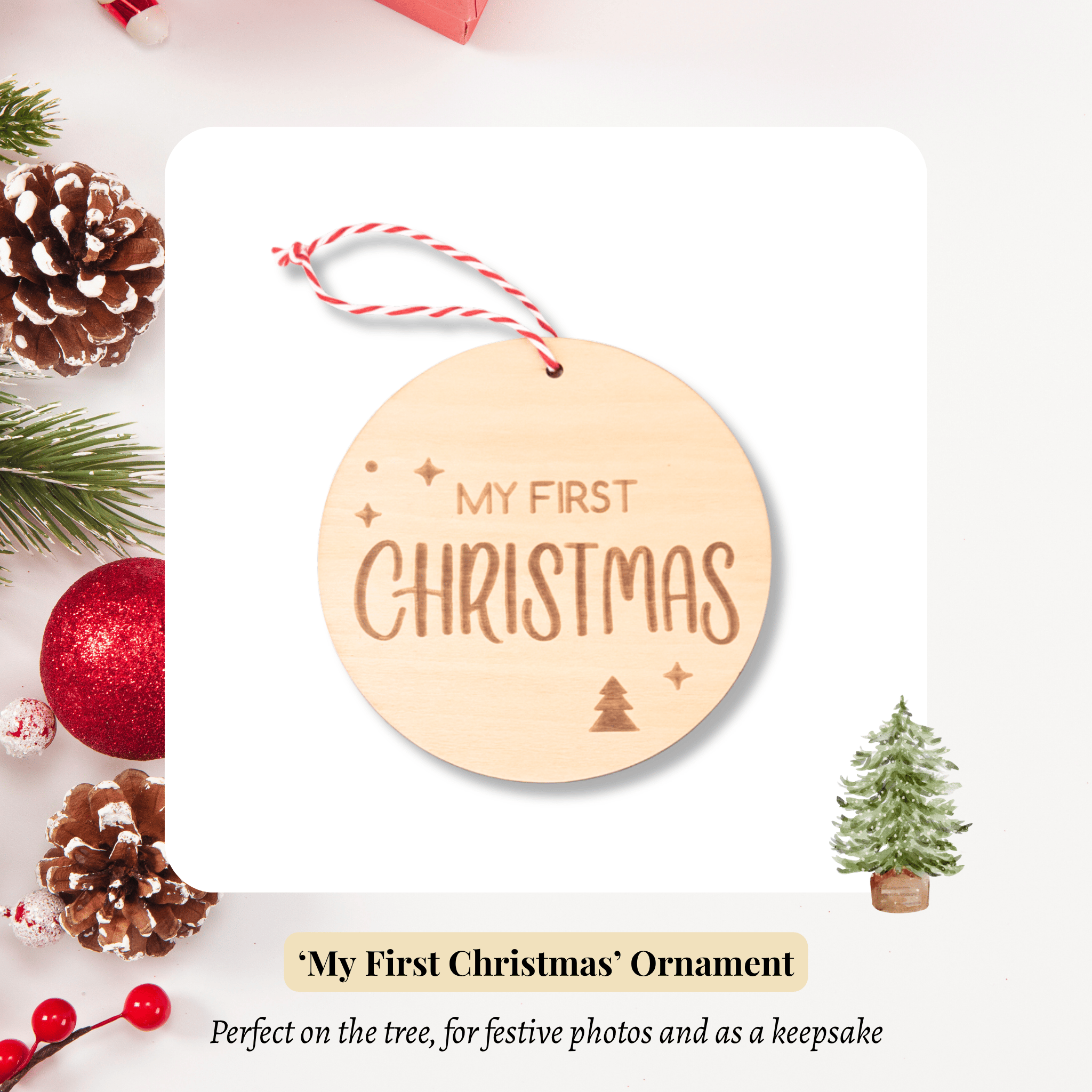 Wooden ornament with 'My First Christmas' text, surrounded by Christmas decorations on a white background.