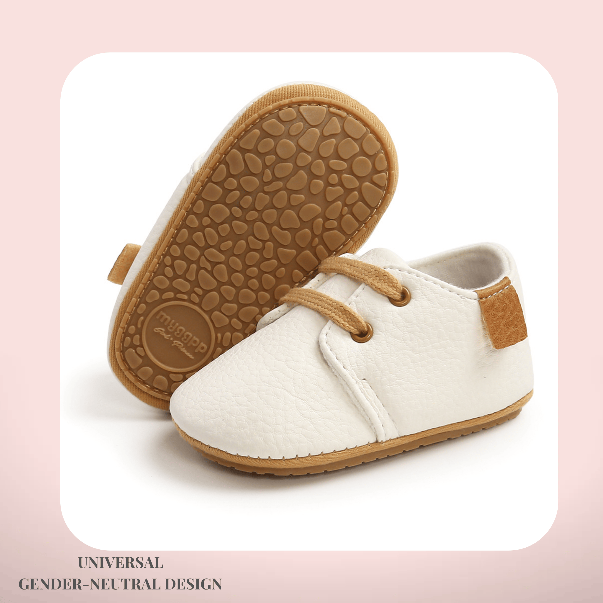 White baby shoes with brown soles on a light pink background